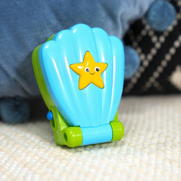 BABY EINSTEIN Hračka hudební telefon Shell Phone™ 6m+